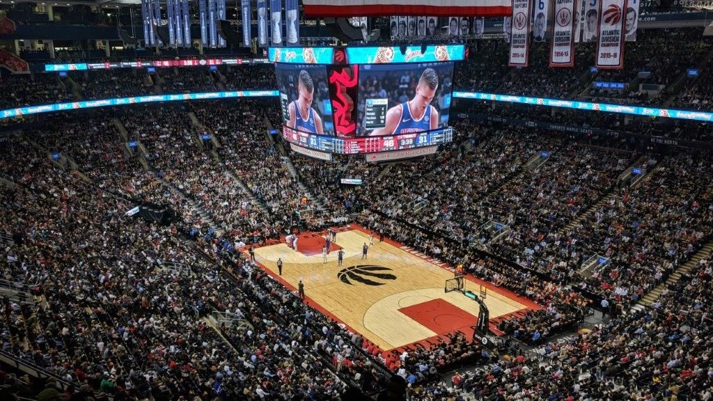 Basketball stadium filled with crowds during a game 